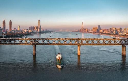 The first bridge over Wanli Yangtze River with cars at top and trains at bottom, China's first dual-use road-rail bridge.