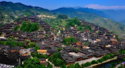 Be sure to visit tourist attraction in Guizhou, largest Miao village in world, although it is now very commercialized.