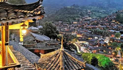 Be sure to visit tourist attraction in Guizhou, largest Miao village in world, although it is now very commercialized.
