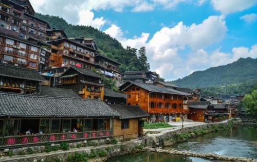 Be sure to visit tourist attraction in Guizhou, largest Miao village in world, although it is now very commercialized.