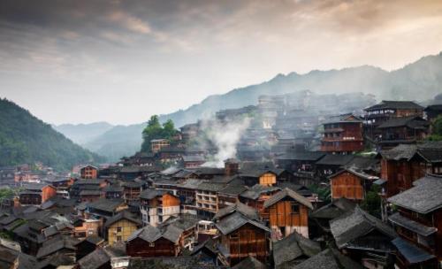 Be sure to visit tourist attraction in Guizhou, largest Miao village in world, although it is now very commercialized.