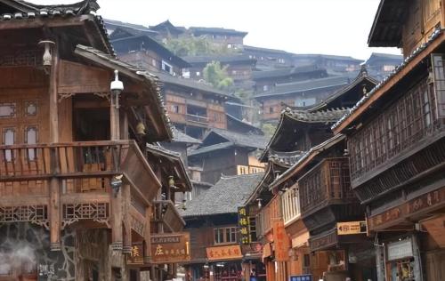 Be sure to visit tourist attraction in Guizhou, largest Miao village in world, although it is now very commercialized.