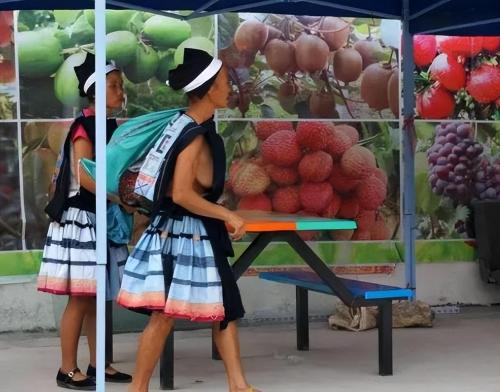 Located in "Mushroom Village" at junction of Guangxi and Guizhou, women dress openly and ask for a man.